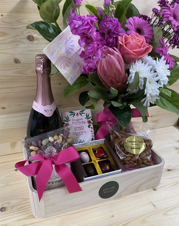 Hamper with flowers, wine, and chocolates