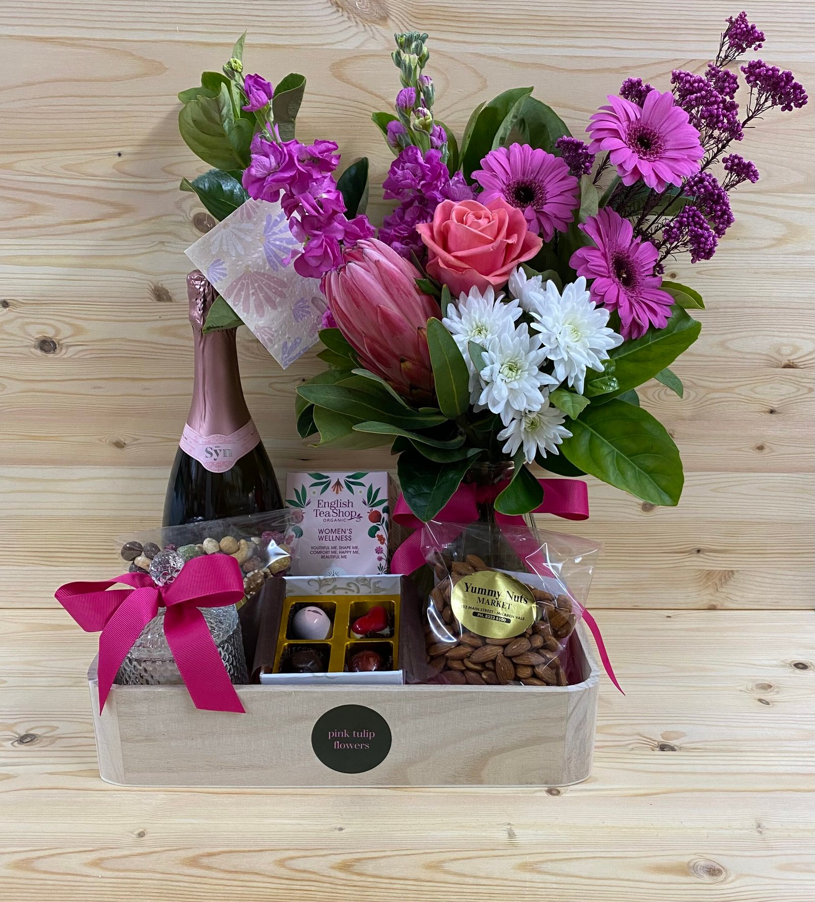 Hamper with flowers, wine, and chocolates