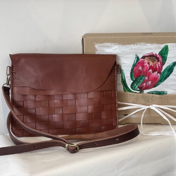 Hand braided leather cow hide sling & clutch bag